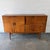 A vintage Danish teak credenza dating to the 1960s, with a compact highboard form and a thoughtful mix of doors, drawers,...