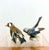 Vintage porcelain figurines are Danish bird sculptures from the manufacturer Bing & Grøndahl. The figurine on the left is...