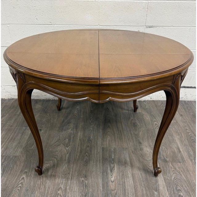 This is a vintage Drexel Basque Provincial Collection dining table in the French Louis XV style 3153-38. It features an...