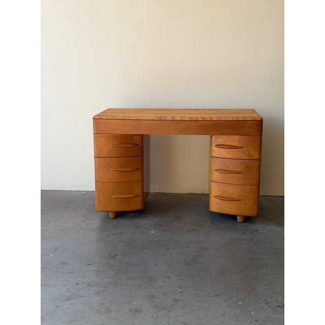 Beautiful vintage mid-century modern desk by Heywood-Wakefield, crafted in solid maple in the 1950s. This piece features...