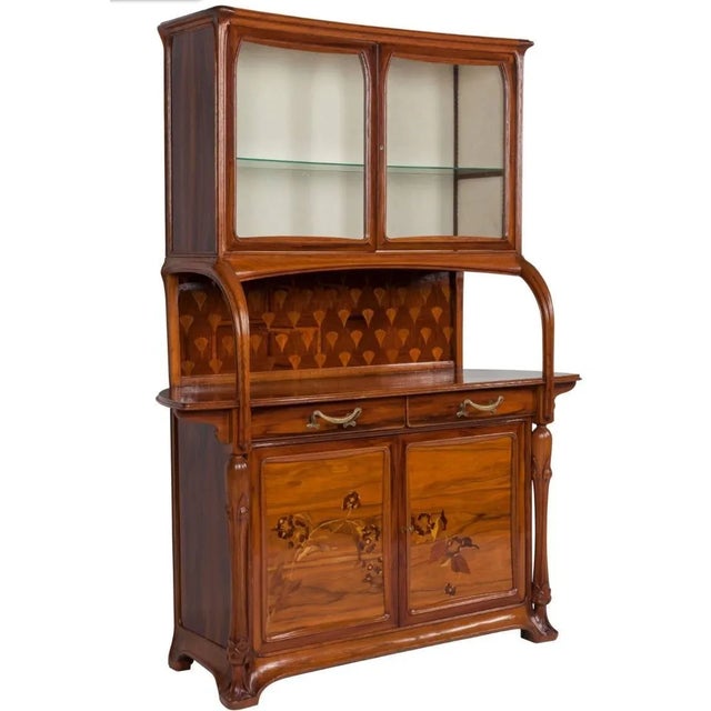 Elegant French vitrine cabinet signed by renowned Art Nouveau designer Louis Majorelle. The cabinet is composed of...
