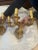 Pair of heavy, Louis the XVI style gilt bronze electrified wall sconces, three arm and richly decorated with scrollwork...