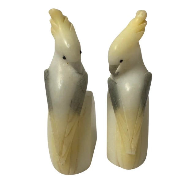 A classics pair of Vintage Alabaster Cockatoo Bird Bookends, Italy Circa 1960. With tones of white, grey and yellow.
