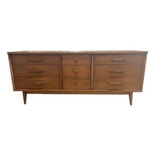 Vintage 1960s Mid-Century Modern 9-Drawer Lowboy Dresser Manufactured by Bassett Furniture. For Sale