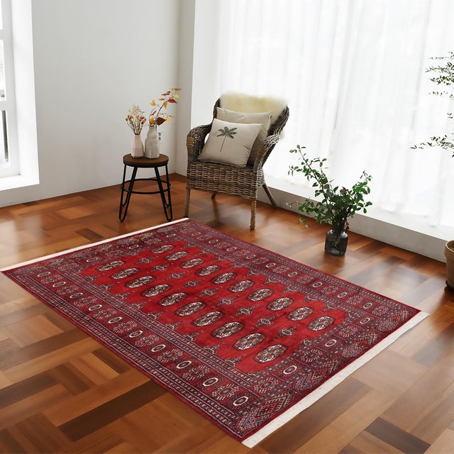 Transform the interior of your home with a beautiful hand-knotted Bokhara rug. Meticulously crafted with intricate...