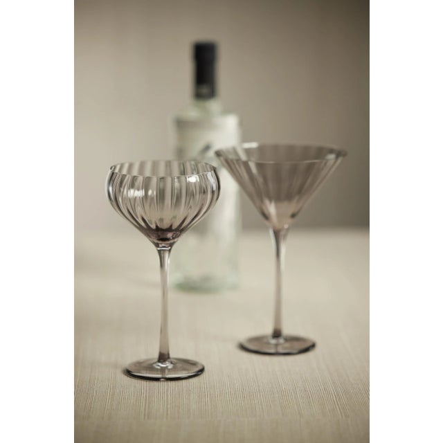 Crafted of beautifully textured glass, the colored glass set features a streamlined design with a pop of color. Set a...