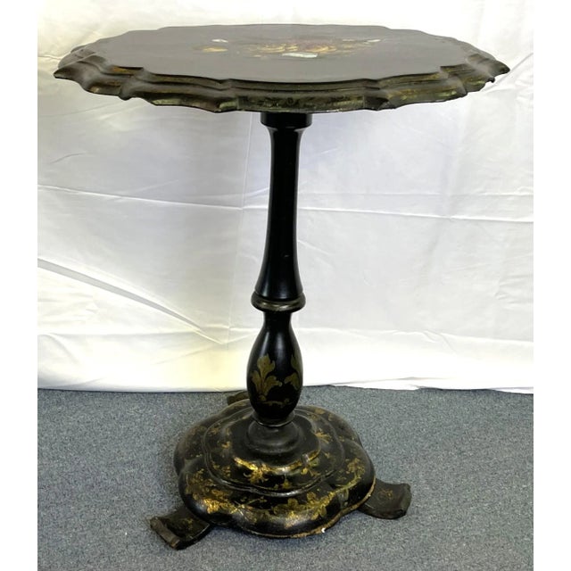 This 19th century flip-top tray table is exquisite! It's made of French papier mâché and wood with a black lacquered...