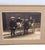 An American or European couple rides side by side in rickshaws. Both tucked in under wool blankets. Japanese men in...