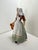 Discover the Royal Doulton “The Milkmaid” HN2057 figurine, a beautifully detailed vintage collectible admired for its...