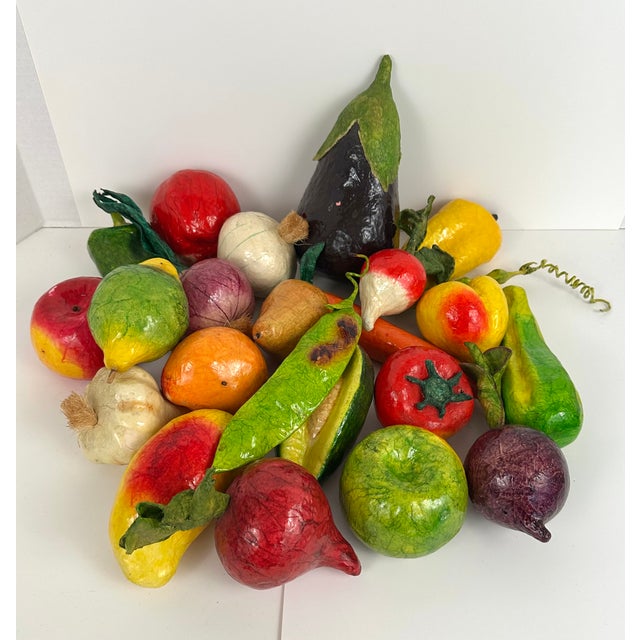 A large set of 23 vintage papier-mâché assorted fruits and vegetables, handmade in Mexico, dated to late 1980s. The set...