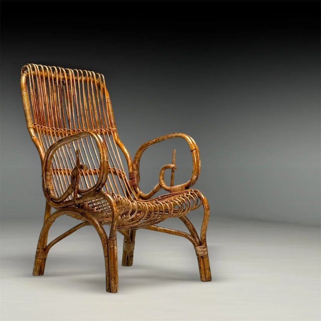 Italian Mid-Century Modern, Armchair, Rattan, Cane, Bamboo, Italy, 1960s This Italian Mid-Century Modern armchair from the...