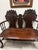 Late Victorian/Edwardian carved mahogany settee, probably circa 1890–1910, with strong Chippendale/Queen Anne Revival...