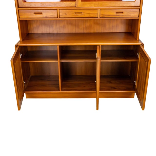 Well-crafted teak hutch and credenza by Sun Cabinet Co. Ltd. Featuring sliding glass display doors, integrated lighting,...