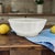 This Limoges Scalloped Serving Bowl is a beautifully preserved white porcelain serving piece with a graceful sculpted rim...