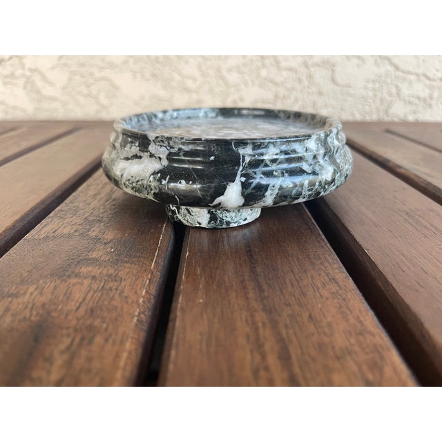 This small vintage pedestal stand is crafted from solid black marble with dramatic white veining throughout. The three...