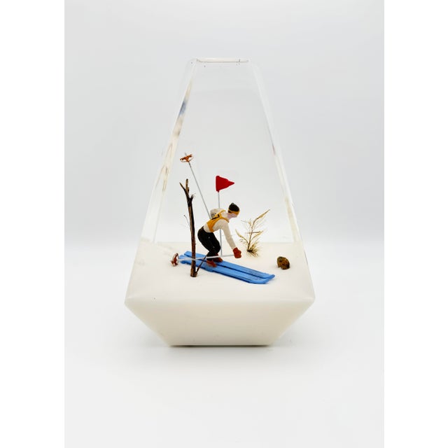 This large lucite slalom racer paperweight is a perfect retro reminder of days on the slopes. There are a couple of small,...