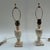 Pair of Italian alabaster table lamps with harps and brass bullet shaped finials. Marked Italy on the base. When I...