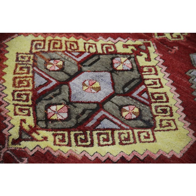 Introducing a one-of-a-kind vintage Turkish hand-knotted wool rug, carefully crafted by skilled artisans using traditional...