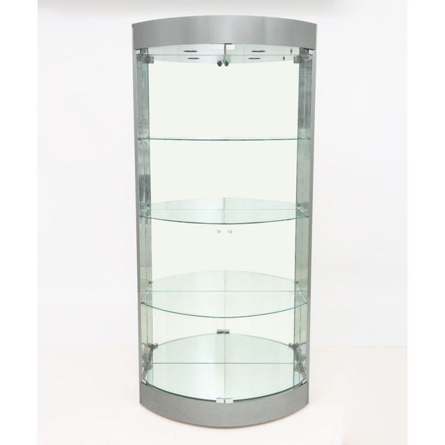 Modern Illuminated Semi-Circular Chrome and Glass Display Cabinet, the two clear glass doors opening to the three glass...