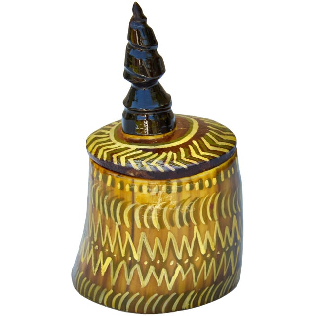 Unique vintage West-African lidded bowl, thoughtfully handmade in an ornate silhouette with natural horn hues. Exhibiting...