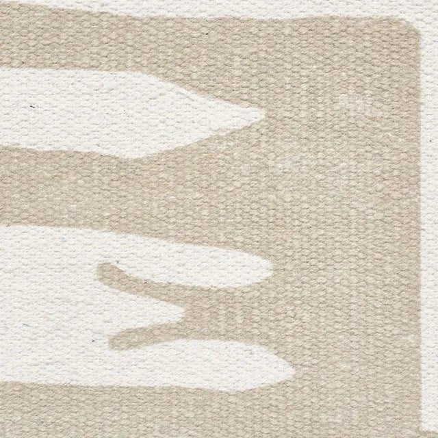 Based on an antique cloth, Copp features an abstract pattern with an asymmetrical border. Printed on a textured flatweave...