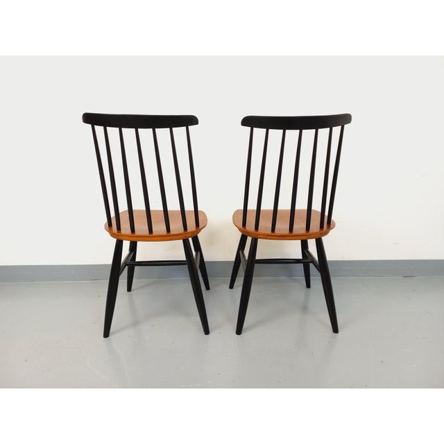 Set of two vintage chairs from the 1950s/60s, Swedish Fanett model by Ilmari Tapiovaara, teak seats, 7-slat backrest, and...