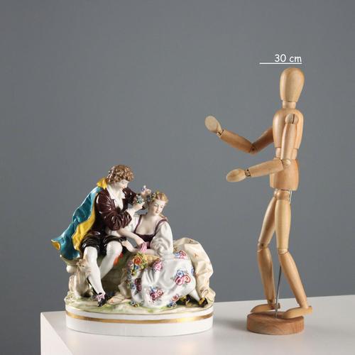 Porcelain sculpture depicting a lady and a gentleman in a gallant scene. Mark attributable to the E & A Muller Thuringia...