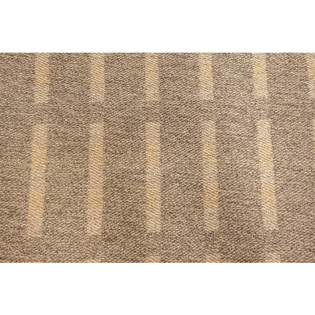 This striking vintage Swedish flat-weave rug showcases the refined minimalism and masterful craftsmanship that...