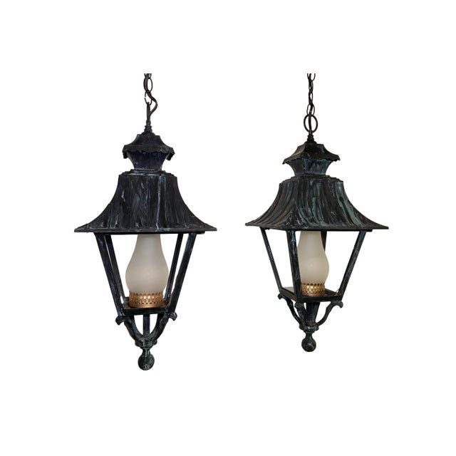 Pair of English Style Verdigris Lantern Chandeliers. Clear glass on the outside with frosted globe on the inside H: 25" W:...