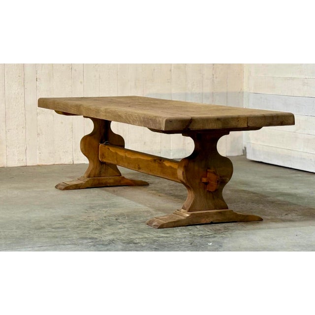 A wonderful solid Oak Farmhouse Dining Table, having loads of character and a great thick top. French in origin and dating...