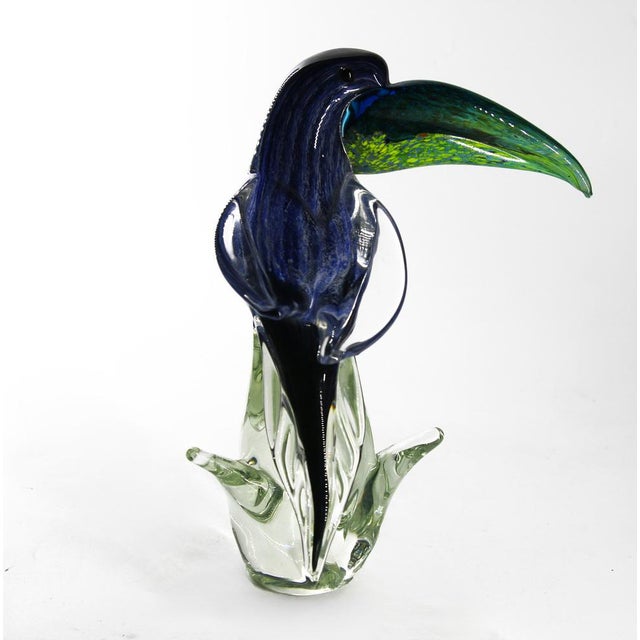 This vibrant toucan sculpture, handcrafted from authentic Murano glass using traditional glassblowing techniques, features...