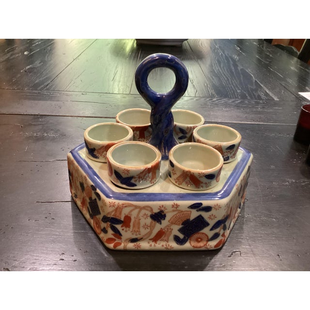 Charming ironstone votive candleholders in Asian motif. This piece can be a wonderful accent on any side table, buffet,...