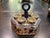 Charming ironstone votive candleholders in Asian motif. This piece can be a wonderful accent on any side table, buffet,...
