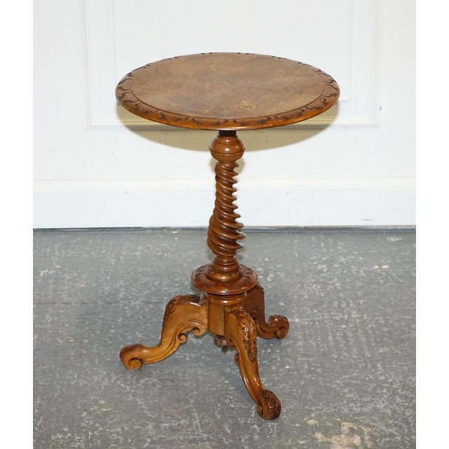 This stunning antique burr walnut pedestal side table is a fine showcase of 19th-century craftsmanship, featuring richly...