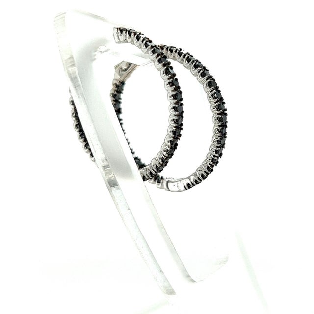 These hoop earrings have Natural Round Cut Black Diamonds that weigh 1.73 carats. They are set in 14 Karat White Gold and...