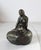 Vintage cast metal mermaid figure sitting on rock. Made in Denmark. Some light age wear.