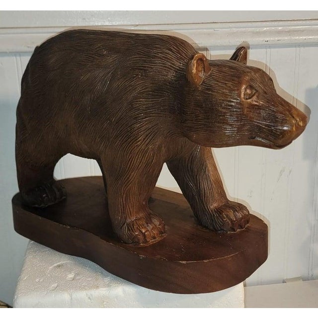 This fine large hand carved brown bear has amazing details in the carving.The condition is very good.This came from a log...