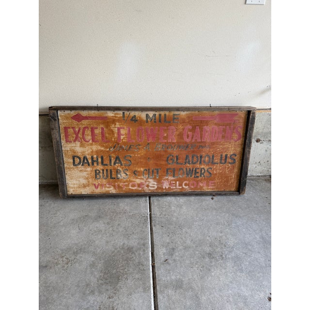 Vintage double-sided metal sign for Excel Flower Gardens, featuring hand-painted lettering, directional arrows, and...
