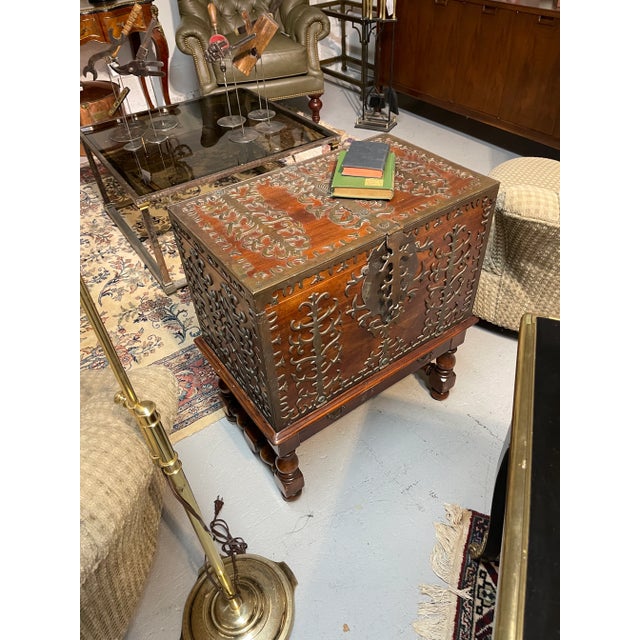 A large vintage wood truck or bible box covered in elaborate pierced iron work with a hinged lid, single full-length...