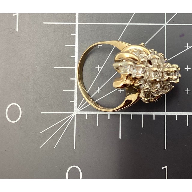 Vintage 14k yellow with white gold and round diamond waterfall cocktail ring. Consists of 27 prong set round diamond melee...