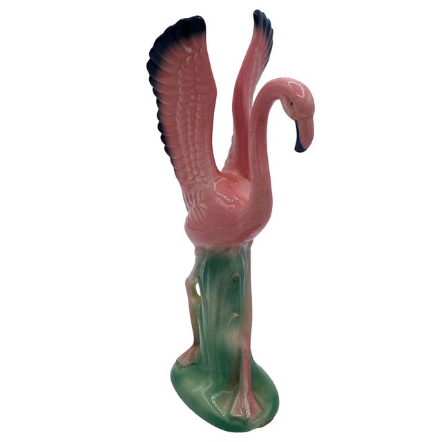 Mid-century pink and green ceramic flamingo statue set by Leftons. The set features two beautifully detailed pink...