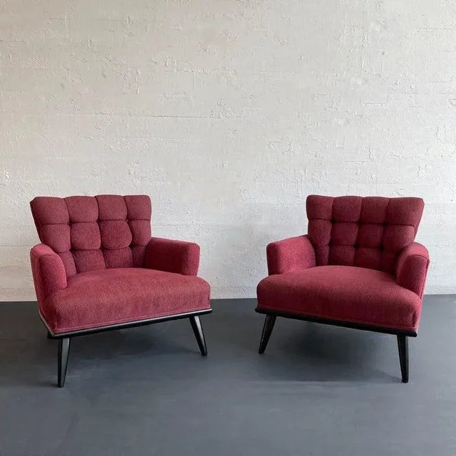 Pair of Hollywood Regency, low, lounge, armchairs circa 1940's have satin finish, black lacquered, walnut bases with fully...