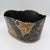 A hand-painted tole cachepot in the Monteith style — the scalloped, wave-edged rim characteristic of that form — set on...