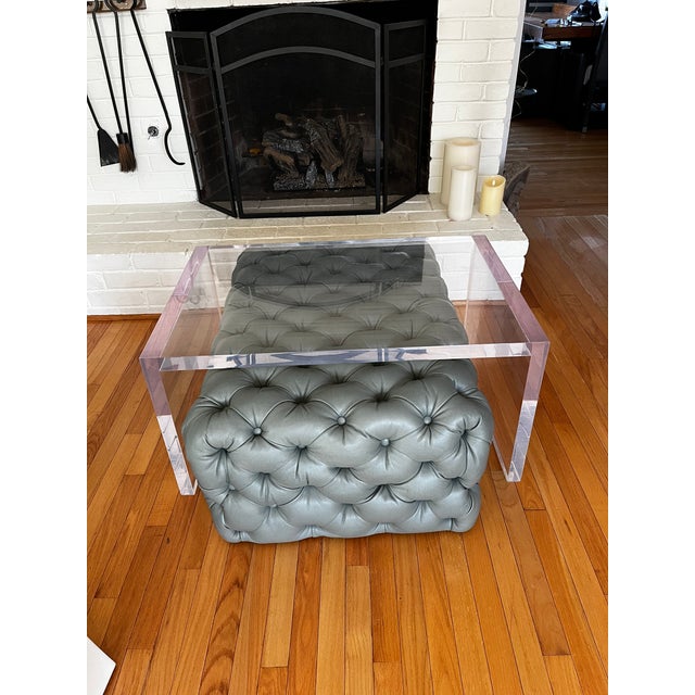 Stunning custom coffee table ottoman in a beautiful blue hue. The pair will provide timeless sophistication to any room,...