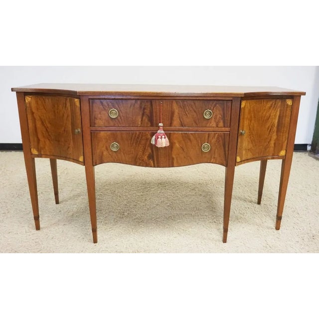 Federal-Style Inlaid Mahogany Sideboard Buffet with Tapered Legs and Dovetailed Drawers. Features two center drawers and...