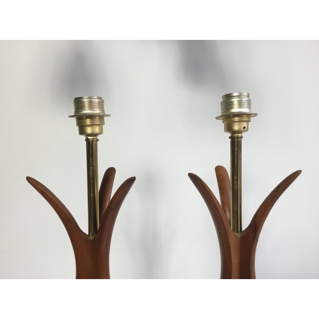 Beautiful rare pair of vintage 1960s tall lamps with sculptural walnut body and base in polished brass. All original. This...