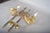 A rare and elegant pair of brass swing-arm wall lamps attributed to maison jansen, the renowned parisian decorating house...