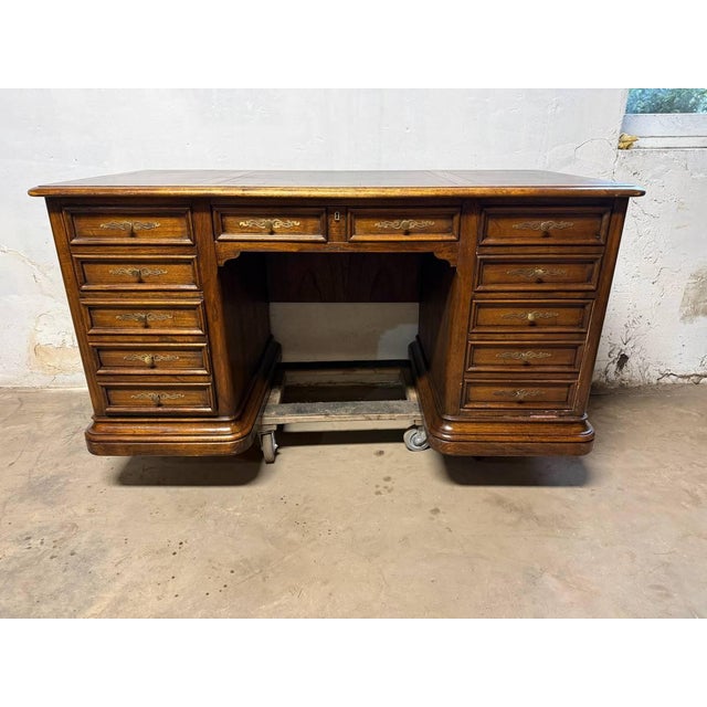 Vintage Hekman Oak Tooled Leather Top Executive Office Desk. The top has tooled leather panels, there are two file...