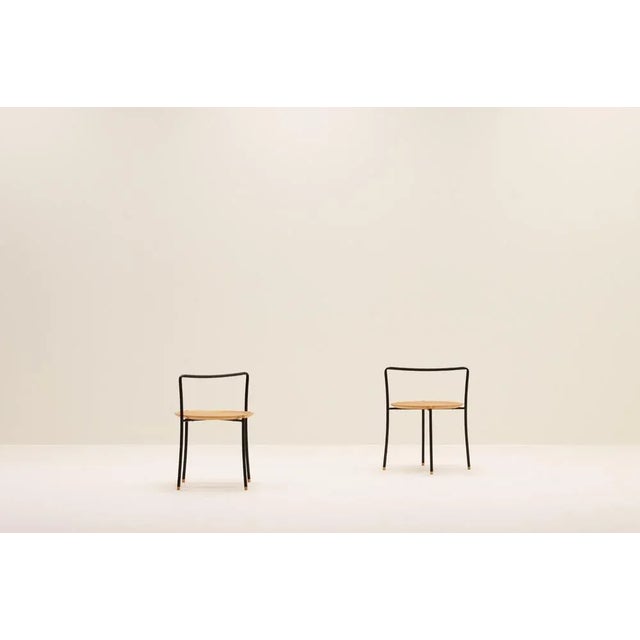 Set of 2 handle side tables, 80’s. Black metal frame and plywood top. Unknown designer, but beautifully made with nice...