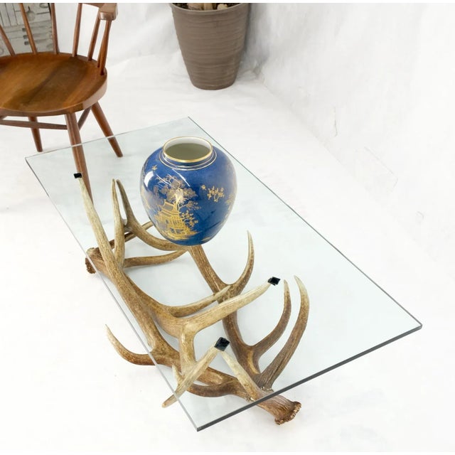 Antler Grouping base glass rectangle top coffee table Folk Art Mid-Century Modern. Artist signed. Glass top measures 1/2''...